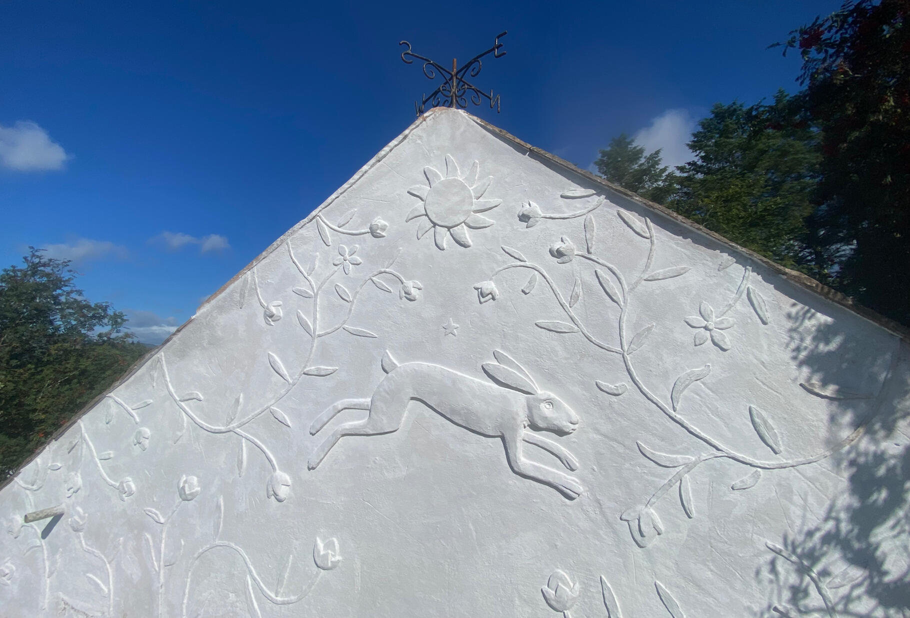 Hare and Flax mural in lime plaster